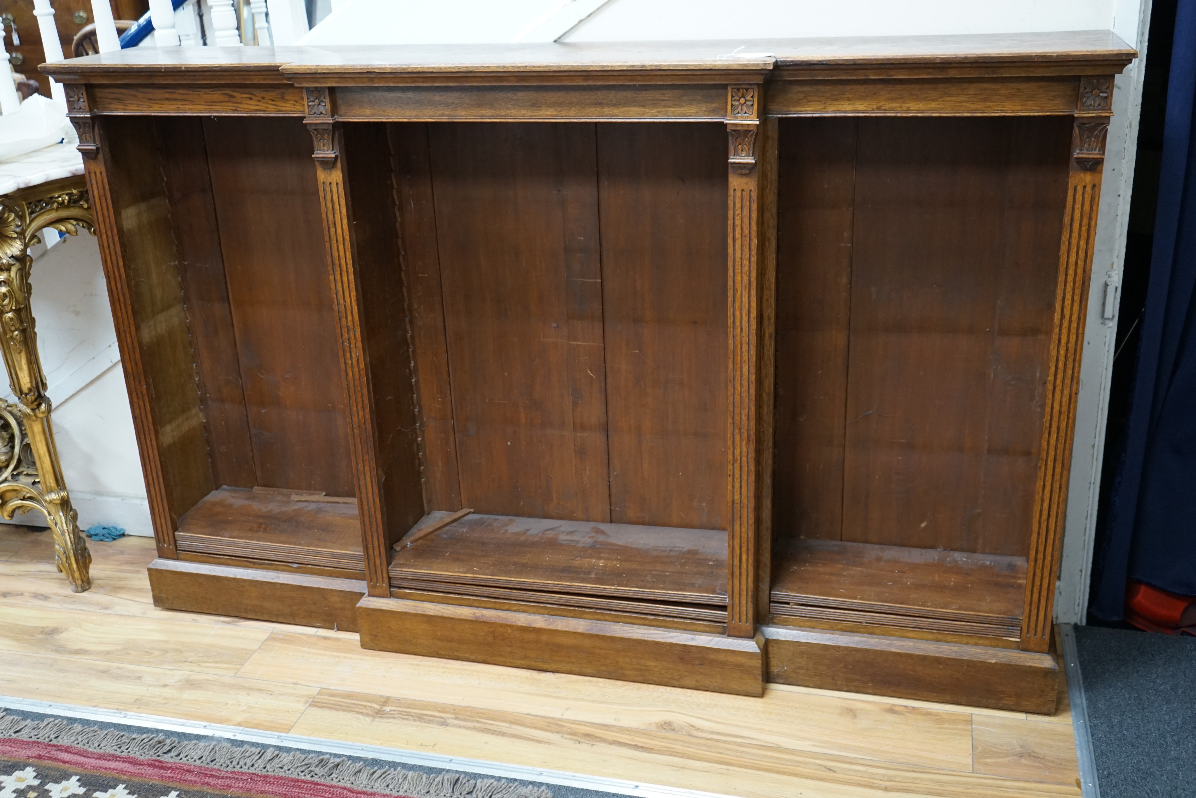 A late Victorian oak breakfront open dwarf bookcase, length 183cm, depth 34cm, height 114cm